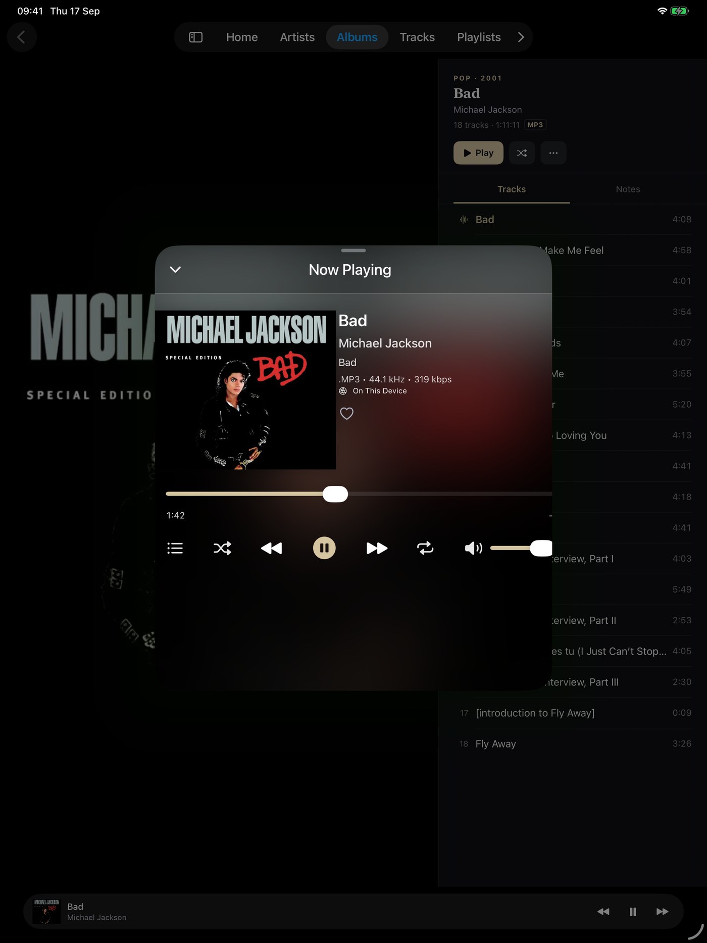Now Playing on iPad as a sheet over the album, with artwork, track details, the audio format, a scrubber and transport controls.