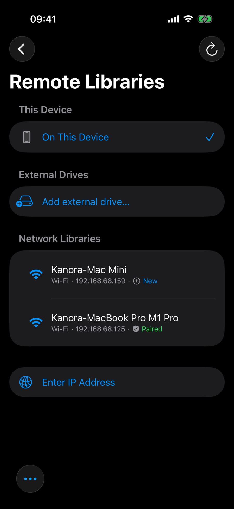 The iPhone library switcher: the library on this device, and a paired Mac host under Network Libraries.