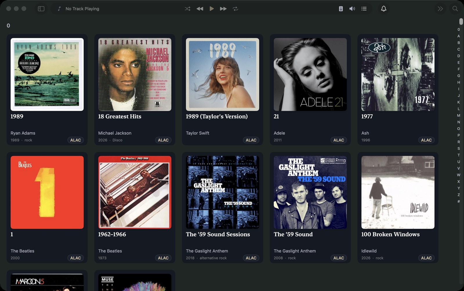 The Mac album grid, sorted alphabetically with an A–Z index, each card showing artwork, year, genre and a lossless format badge.