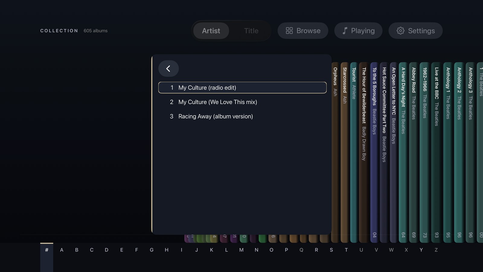 The Shelf view on Apple TV with the open case turned round to show its track list.